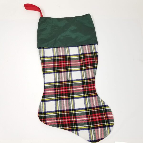 A Stewart Dress Tartan Stocking - Homespun Wool Blend, resting on a white surface.