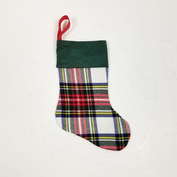 A Stewart Dress Small Tartan stocking on a white background.